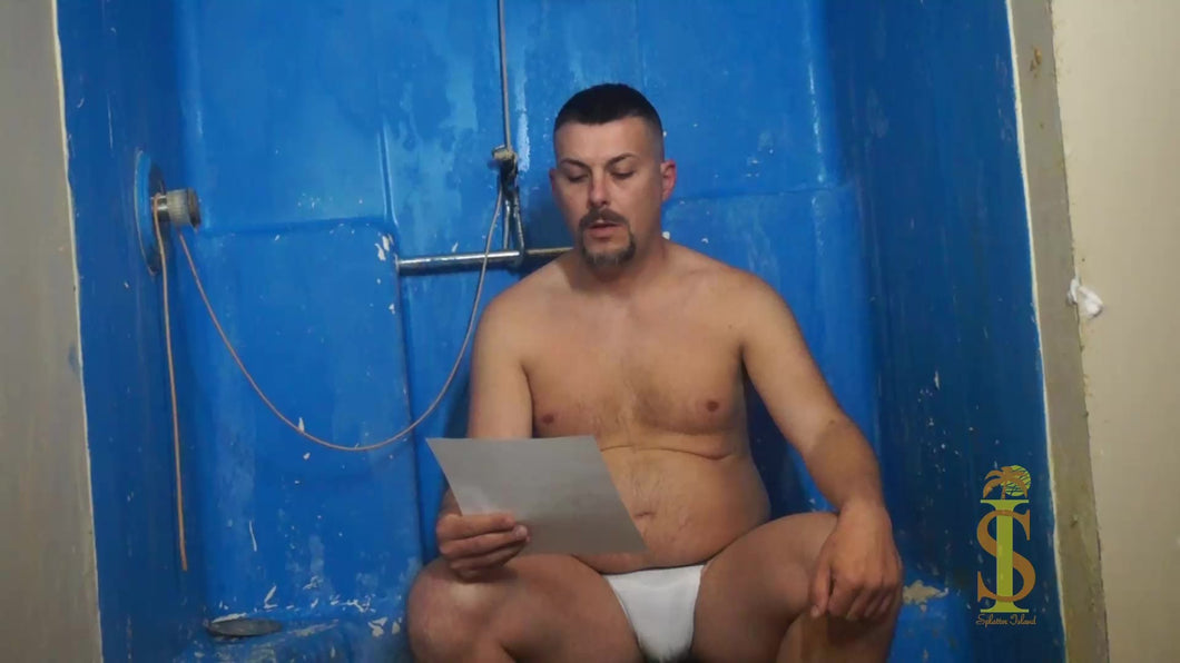Man sits in front of blue background