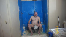 Man sitting looking annoyed