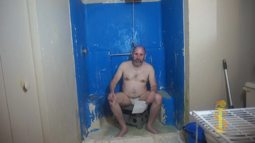 Man sitting looking annoyed